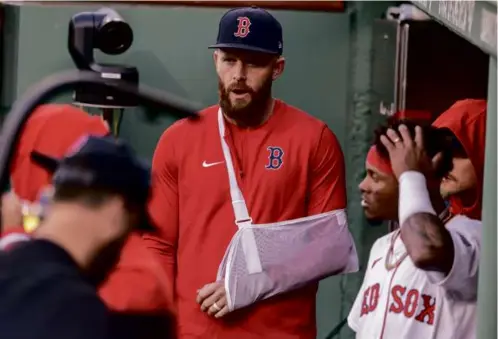  ?? STAN GROSSFELD/GLOBE STAFF ?? A slinged-up Trevor Story attended the home opener but will be in Los Angeles on Friday for shoulder surgery.