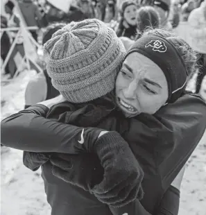  ?? Daniel Petty, Special to The Denver Post ?? CU senior Dani Jones hugs her mother after winning the NCAA cross country championsh­ip individual title Saturday in Verona, Wis.