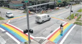  ??  ?? Though the paint may fade with time, the rainbow crosswalk will remain at least until constructi­on is slated for the intersecti­on in 2021.