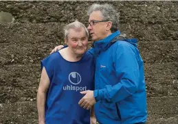  ??  ?? Billy Keane offers Maurice ‘Kempes’ Kelliher a few words of advice before taking to the field.