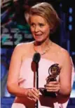  ??  ?? Cynthia Nixon accepts the award for best performanc­e by an actress in a featured role in a play for "Lillian Hellman's The Little Foxes".