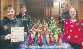  ?? (Pic: Marian Roche) ?? Eoghan and Cormac Vaughan (left) with Ciara and dad Richard, showing their display of hand-crafted reindeer, which are available to order.