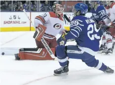  ?? STAN BEHAL/ TORONTO SUN ?? William Nylander scores a third period goal as the Toronto Maple Leafs celebrate 100 years of hockey in the Air Canada Centre by beating the Carolina Hurricanes 8- 1.