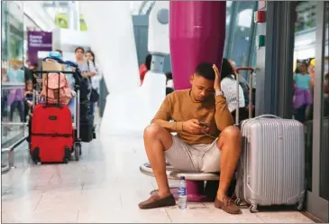  ?? DANIEL LEAL-OLIVAS/AFP ?? Travellers wait at Heathrow Airport Terminal 5 after British Airways flights where cancelled on Saturday.