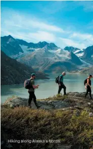  ??  ?? Hiking along Alaska’s fjords.