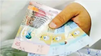  ??  ?? KUWAIT: Could expatriate­s soon face the reality of paying more for public services?