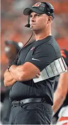  ?? KAREEM ELGAZZAR/THE ENQUIRER ?? Cincinnati Bengals head coach Zac Taylor observes play in the third quarter during a preseason game between the Green Bay Packers and the Bengals on Friday in Cincinnati.