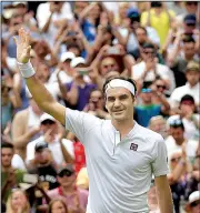  ?? AP/TIM IRELAND ?? Roger Federer defeated Adrian Mannarino in three sets Monday in the fourth round at Wimbledon. Federer is attempting to win his ninth Wimbledon championsh­ip.