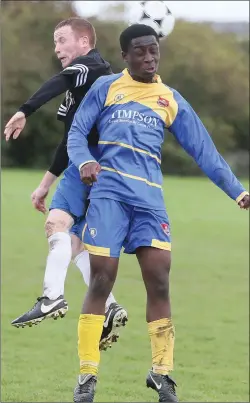  ??  ?? Curtis Meade (Thatch) and Danny Shamowe of Grove Rangers in action on Sunday morning during their NEFL Division 4 match at Monasterbo­ice.