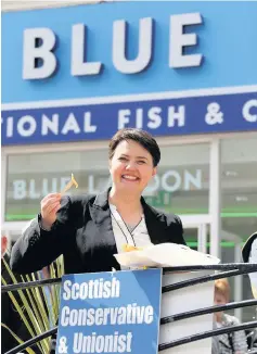  ??  ?? Break Ruth Davidson enjoys a chippie by the beach as the school holidays get underway, but the reckons the SNP’s report card would not make good reading