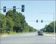  ?? Westside Eagle Observer/MIKE ECKELS ?? A set of new stoplights at the entrance to the Simmons Food plant on Arkansas 59 between Decatur and Gentry on July 23 should be in operation soon.