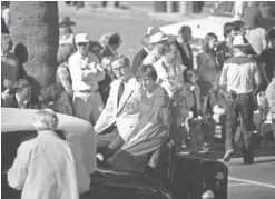  ?? COURTESY OF MICHAEL DUPONT ?? Donald Dupont, one of the founders of the Fiesta Bowl, rides in a car in the Fiesta Bowl Parade in 1979.