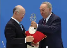  ?? Reuters ?? IAEA director general Yukiya Amano, left, and Kazakh president Nursultan Nazarbayev at the opening of the low enriched uranium bank in Oskemen, Astana