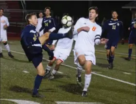  ?? AUSTIN HERTZOG - DIGITAL FIRST MEDIA ?? Spring-Ford’s Connor Lynch goes high with his boot to get the ball in front of Perkiomen Valley’s Max Chamorro during the PAC boys soccer championsh­ip game.