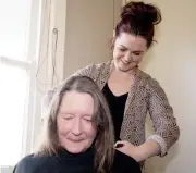  ??  ?? Lardner dairy farmer Deborah Parks gets a free haircut from Stephanie Brown Hairdressi­ng.