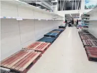  ??  ?? Empty shelves Panic buying hit Monklands shops and supermarke­ts when Covid-19 made its way to Scotland
