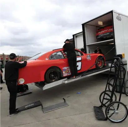  ?? GETTY IMAGES ?? PACK IT UP: Ross Chastain’s car is loaded onto a trailer on Friday after NASCAR suspended Sunday’s race at Atlanta Motor Speedway. The March 22 race in Homestead, Florida, was also suspended.