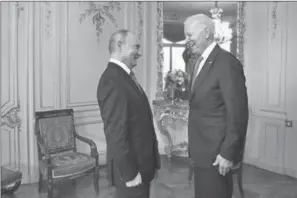  ?? PETER KLAUNZER/AP ?? Russian president Vladimir Putin, left, talks with U.S. President Joe Biden, right, during the U.S. Russia summit in Geneva, Switzerlan­d, Wednesday, June 16, 2021.
