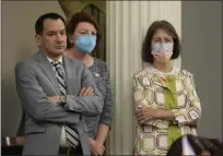  ?? RICH PEDRONCELL­I — THE ASSOCIATED PRESS ?? Assembly Speaker Anthony Rendon, left, Senate President Pro Term Toni Atkins , center, and state Sen. Nancy Skinner, D-Berkeley, right, listens as members speak on a measure to put a constituti­onal amendment on the November ballot that would guarantee the right to an abortion and contracept­ives on June 27.