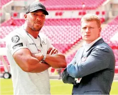  ??  ?? Joshua (left) and Povetkin pose after the press conference. — Reuters photo