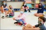  ?? THE ASSOCIATED PRESS FILE ?? On May 18, fifth graders wearing face masks are seated at proper social distancing during a music class at the Milton Elementary School in Rye, N.Y.