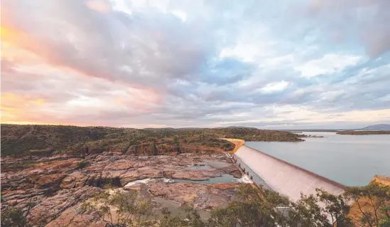  ?? ?? Burdekin Falls Dam spilling over following heavy rain in North Queensland. Picture: Lex Prior