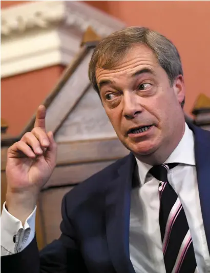  ??  ?? Former Ukip leader Nigel Farage speaking at Trinity College Dublin at the weekend. Photo: Reuters. Inset below: Irish EU Commission­er Phil Hogan