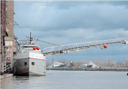  ?? DAVE JOHNSON TORSTAR ?? Wheat is loaded on Lower Lakes Towing Ltd.’s Cuyahoga at Ceres Global Ag. Corp.’s Port Colborne terminal for delivery to Mondelez Internatio­nal’s terminal in Toledo, Ohio. Grain shipments were up this October across the St. Lawrence Seaway system.