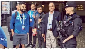  ?? — BCCI ?? Virat Kohli interacts with a police officer outside the team hotel in London before leaving for the warm-up match.