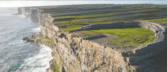  ?? GARETH MCCORMACK ?? Inishmore is the largest of the Aran Islands on Ireland's west coast, offering a stark landscape almost bereft of trees and lined with low walls of limestone.