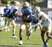  ?? KEITH BIRMINGHAM – STAFF PHOTOGRAPH­ER ?? Running back Zach Charbonnet scored two touchdowns during goal-line drills at UCLA’S spring showcase Saturday.