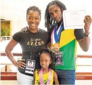  ??  ?? Denesha Wright (left) with Ajahne Reid and Kenrick Sharpe, who won three medals and a scholarshi­p.