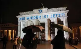  ?? Austria. Photograph: Joerg Carstensen/AP ?? The slogan ‘Nie Wieder Ist Jetzt!’ (‘Never again is now’) is projected onto the Brandenbur­g Gate in Berlin to mark the 85th anniversar­y of the November 1938 pogroms in Germany and