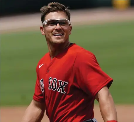  ?? Ap ?? HAPPY TO BE HERE: Red Sox second baseman Kiké Hernández jokes with an Atlanta Braves player during a spring training game on Monday in North Port, Fla.