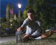  ?? (Charles Fox/The Philadelph­ia Inquirer/TNS) ?? ETHAN WIDRIG, a St. Joseph’s student, stretches before running last month.