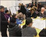  ?? JEREMY P. KELLEY/STAFF ?? Dayton school staff and concerned residents gather Thursday night at Meadowdale Elementary to provide feedback to officials who are weighing whether to close any schools.