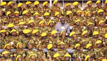  ??  ?? Junior Presidenti­al Guard soldiers follow proceeding­s at the official opening of the Junior Parliament and Day of the African Child commemorat­ions at the City Sports Centre in Harare yesterday. Picture: Believe Nyakudjara