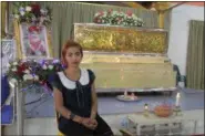  ?? THE ASSOCIATED PRESS ?? Chiranut Trairat, mother of an 11-month-old baby girl, sits in front of her daughter’s coffin at Si Sunthon temple in Phuket, Thailand, Wednesday. Her husband upset with her hanged their daughter on Facebook Live and then killed himself, police said.