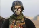  ?? KHALID MOHAMMED, THE ASSOCIATED PRESS ?? A masked member of Iraq’s elite special forces joins the advance to Mosul.