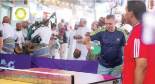  ??  ?? Visitors play table tennis at the launching function of TTX game at Muttrah.