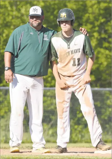  ?? H John Voorhees III / Hearst Connecticu­t Media ?? New Milford coach Ryan Johnson talks with Luke Pliego after he reached third in a March 29, 2018, game against Greenwich in New Milford.