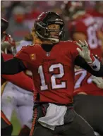  ?? File photo ?? Months after leading Tampa Bay to the Super Bowl title, Tom Brady signed a contract extension to give the Bucs more cap room in 2021.