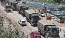  ?? — PTI ?? Army vehicles leave for Leh, on the Manali-Leh highway, on Friday.