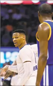  ?? SUE OGROCKI — ASSOCIATED PRESS ?? Russell Westbrook, left, comments to Kevin Durant when the Thunder and Warriors met in February.