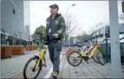  ?? GAO ERQIANG / CHINA DAILY ?? Zhuang Ji has made reporting offences of other shared bike users his hobby. There are thousands more like him in China.