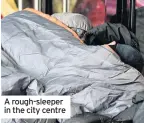  ??  ?? A rough-sleeper in the city centre