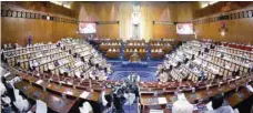  ?? — AFP ?? Sudanese parliament members during an emergency session on Monday.