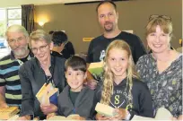  ?? PHOTO: JARED MORGAN ?? Hooked on books . . . Making the most of the first day of the Rotary Club of Alexandra’s annual book sale are (from left) Pat and Carolyn Cooney, and Stefan (8), Hendrik, Olivia (10) and Amy Delport, all of Alexandra.