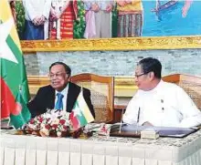  ?? AFP ?? Bangladesh’s Foreign Minister A.H. Mahmoud Ali (left) and Myanmar Union Minister U Kyaw Tint Swe attending a bilateral agreement signing ceremony in Naypyidaw.