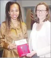  ?? ?? ‘Unsung Heroes’ author posing with US Embassy Public Affairs Officer Stephanie Sandoval while holding the book.